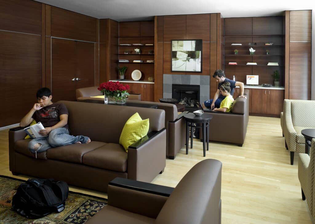 Family relaxing in modern living room.