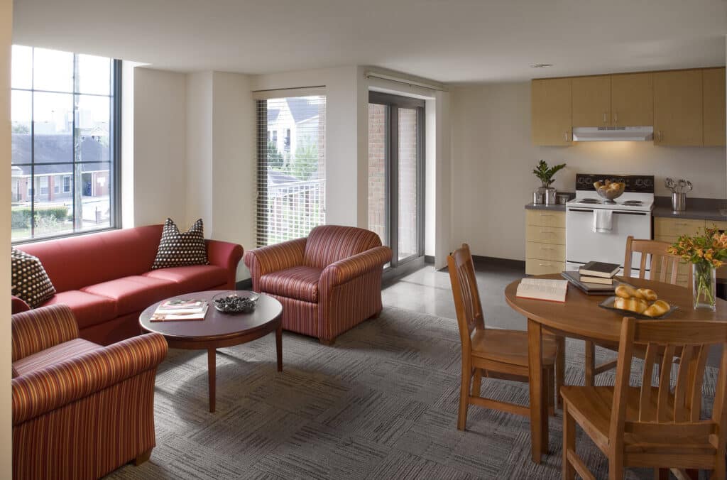 Modern living room with kitchenette and large window