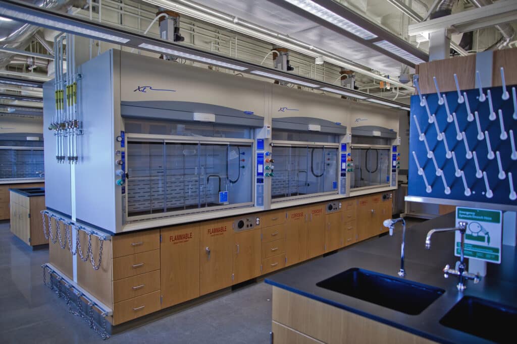 Modern laboratory with fume hoods and equipment.